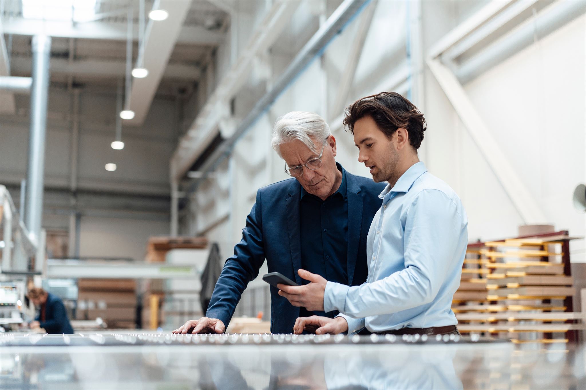 Two-men-looking-at-smartphone